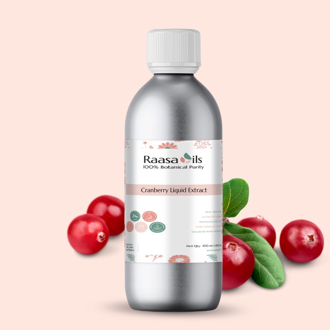 Bottle of Raasa Oils Cranberry Liquid Extract with cranberries and leaves on a light pink background