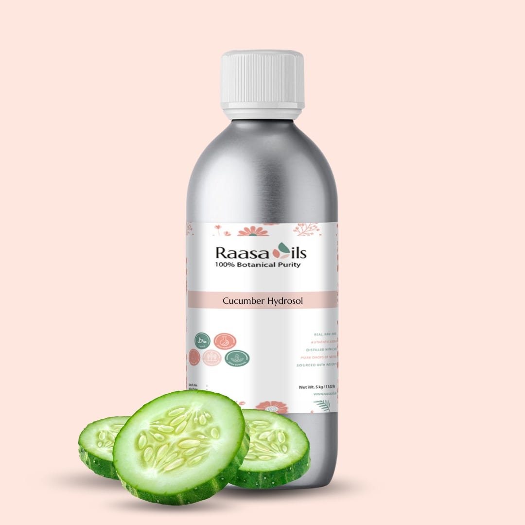Bottle of Raasa Oils Cucumber Hydrosol with sliced cucumber on a beige background