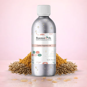 Bottle of Raasa Oils Cumin Fragrance Oil with cumin seeds on a pink background