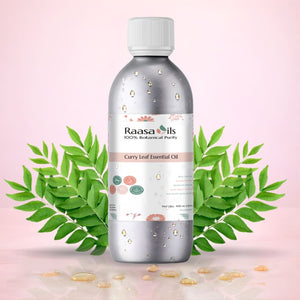 Bottle of Raasa Oils Curry Leaf Essential Oil with curry leaves on a pink background