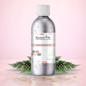 Raasa Oils Cypress Fragrance Oil bottle with decorative elements on a pink background