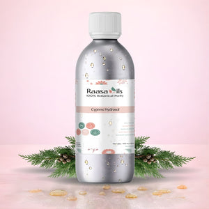 Raasa Oils Cypress Fragrance Oil bottle with decorative elements on a pink background