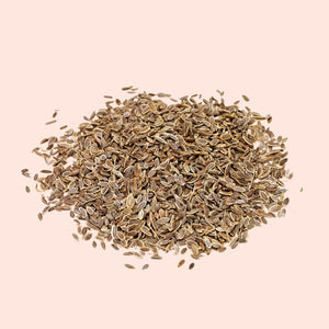 Heap of dried herbs on a beige background