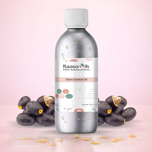 Bottle of Raasa Oils essential oil with damian fruits on a pink background