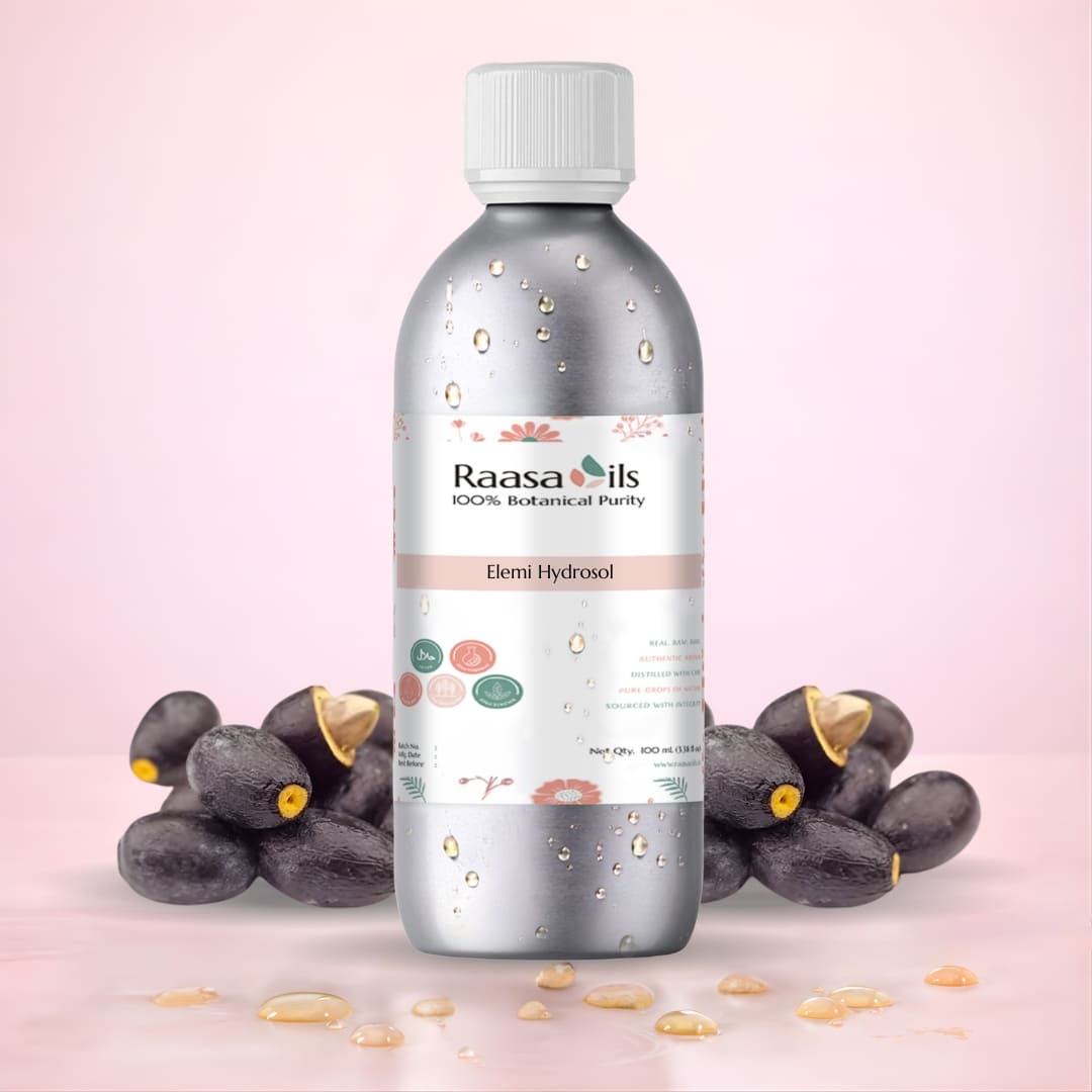 Bottle of Raasa Oils Elemi Hydrosol with elemi fruits on a pink background