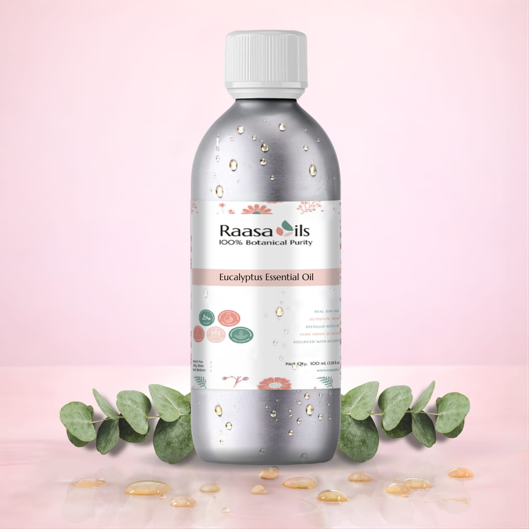 Raasa Oils Eucalyptus Essential Oil bottle on a pink background with eucalyptus leaves.