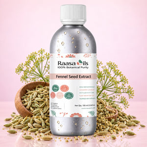 A bottle of Raasa oils Fennel Seed Extract centered on a pink background, surrounded by loose fennel seeds, a wooden bowl, and fennel flowers. The bottle is metallic silver with a white cap and a white label featuring green and coral accents.