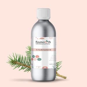 Bottle of Raasa Oils Fir Needle Essential Oil with a branch on a light pink background
