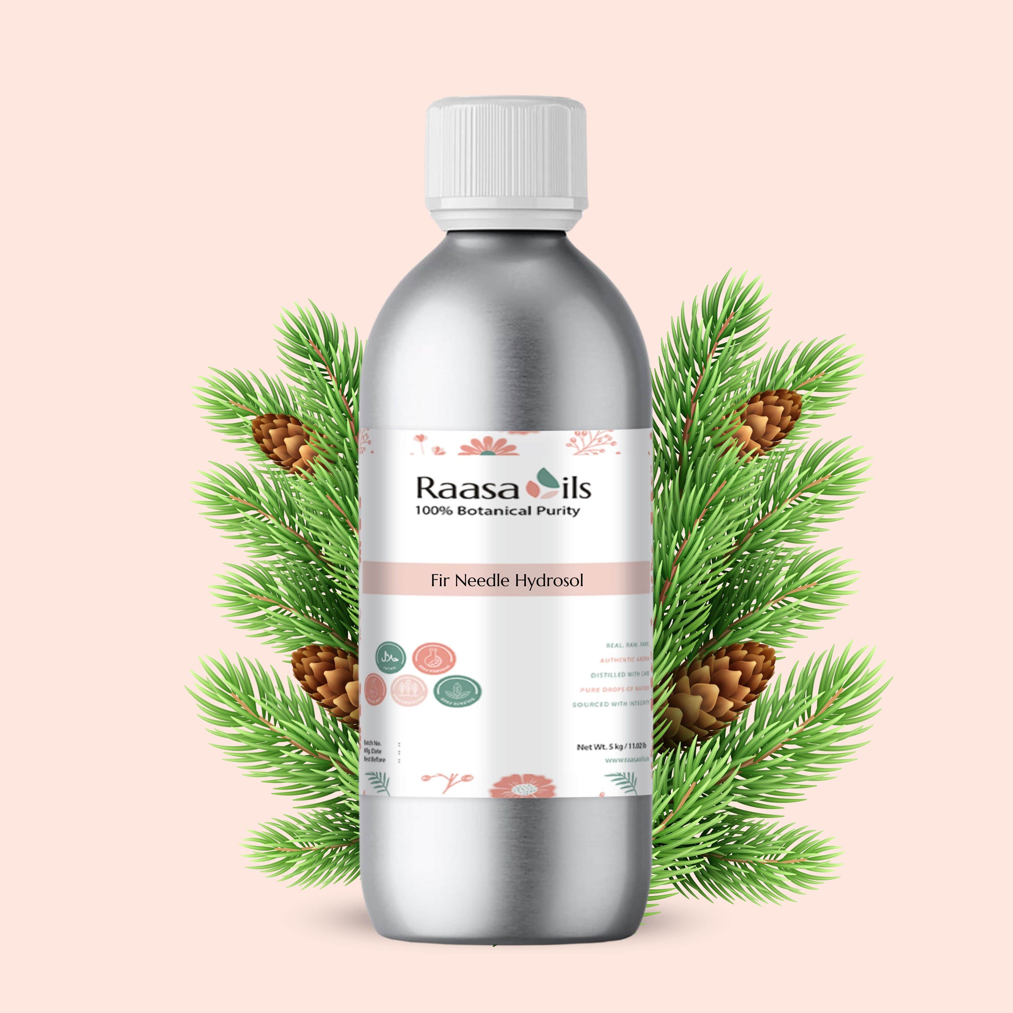 Silver bottle of Raasa Oils Fir Needle Hydrosol with green branches and pine cones on a light pink background