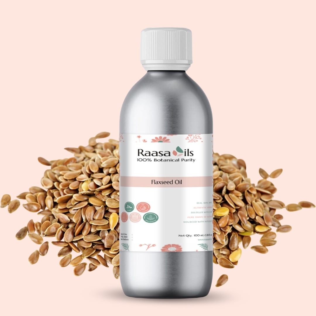 Bottle of Raasa Oils Flaxseed Oil with flaxseeds on a light pink background