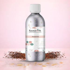 Bottle of Raasa Oils flaxseed oil with seeds on a pink background