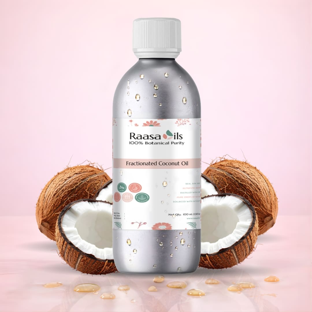 Bottle of Raasa Oils Fractionated Coconut Oil with coconuts on a pink background
