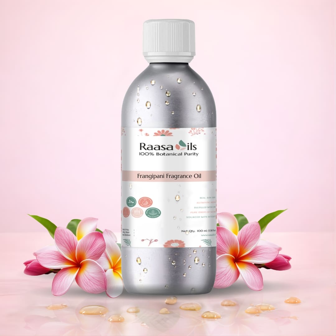 Bottle of Raasa Oils Frangipani Fragrance Oil with flowers on a pink background