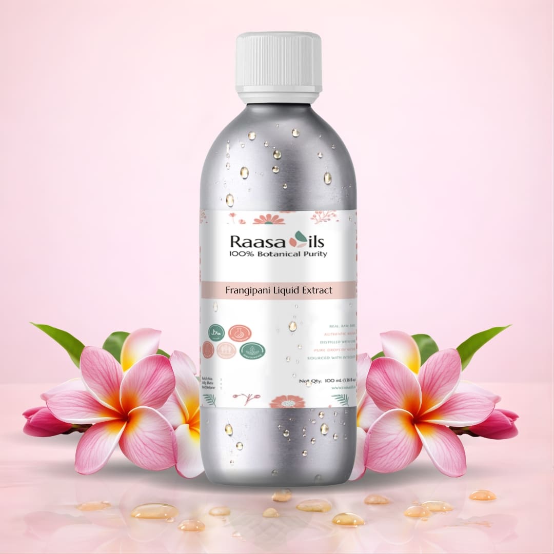 Raasa Oils bottle with frangipani flowers on a pink background