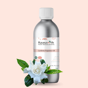 Bottle of Raasa Oils Gardenia Fragrance Oil with a white cap on a light pink background