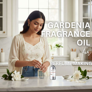 Woman making perfume with gardenia fragrance oil in a kitchen setting