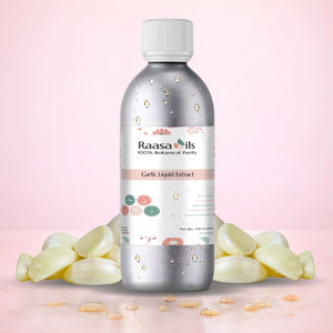 Bottle of Raasa Oils Garlic Liquid Extract with garlic bulbs on a pink background
