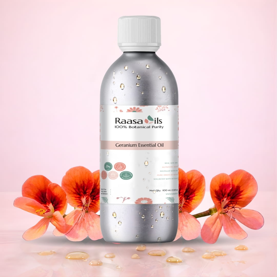 Raasa Oils Geranium Essential Oil bottle with flowers on a pink background