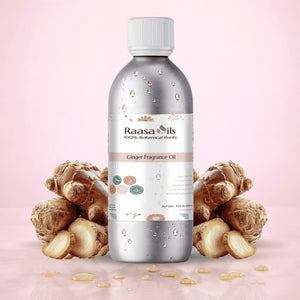 Bottle of Raasa Oils Ginger Fragrance Oil with ginger roots on a pink background