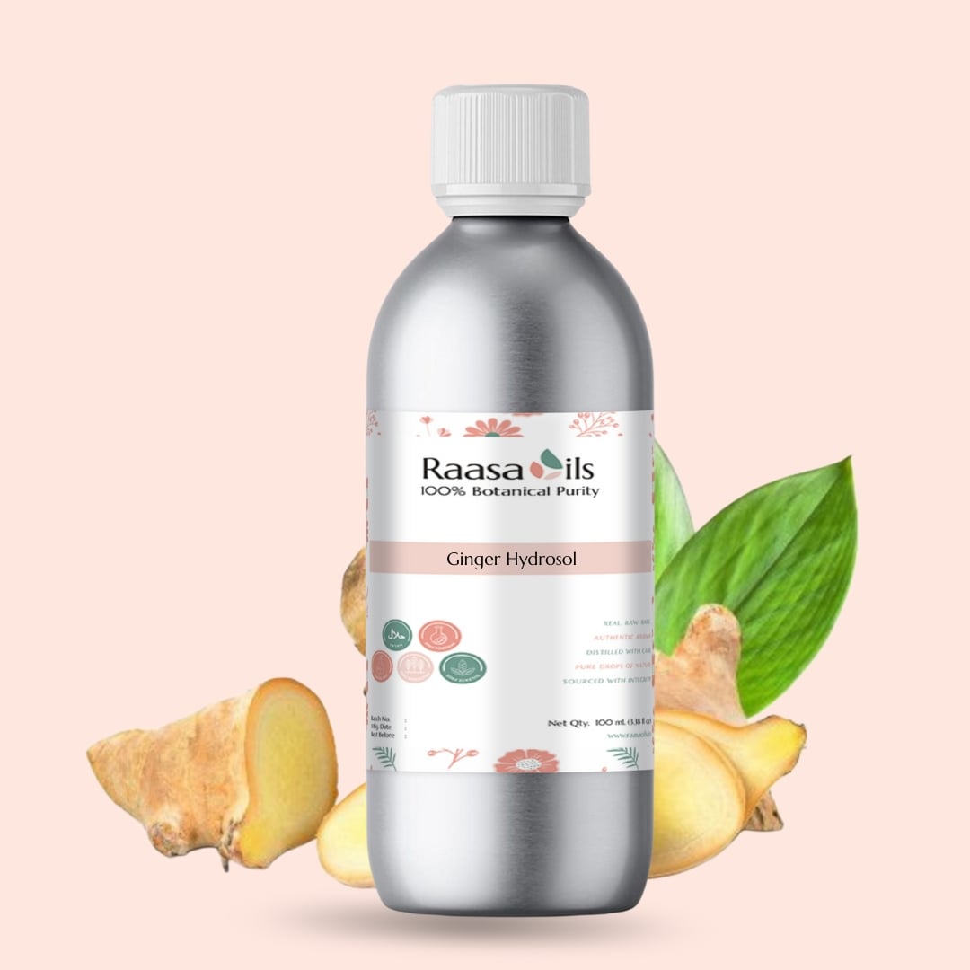 Bottle of Raasa Oils Ginger Hydrosol with ginger root and leaves on a light pink background