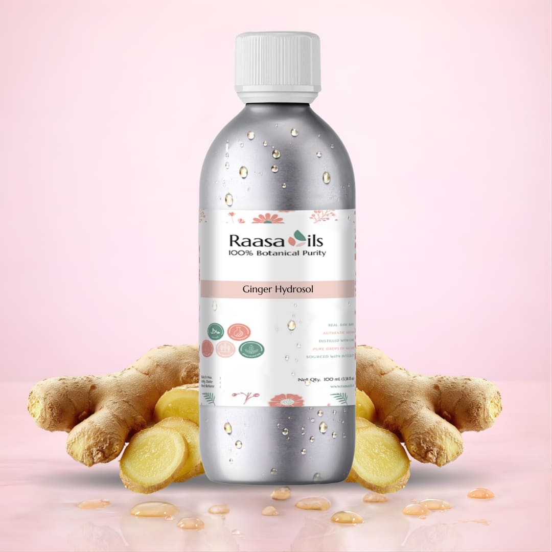 Bottle of Raasa Oils Ginger Hydrosol with ginger roots on a pink background