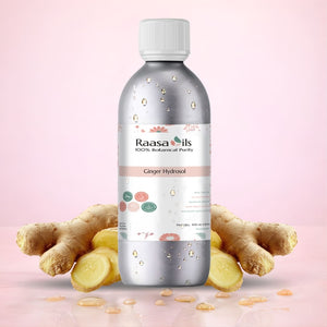 Bottle of Raasa Oils Ginger Hydrosol with ginger roots on a pink background