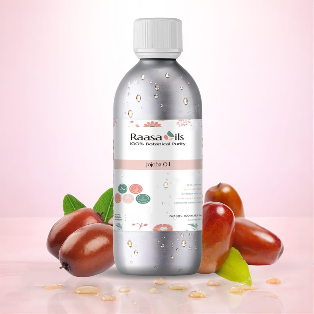 Bottle of Raasa Oils Jojoba Oil with jojoba fruits on a pink background