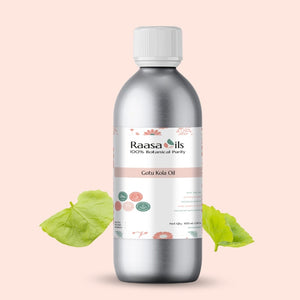 Bottle of Raasa Oils Gotu Kola Oil with green leaves on a light pink background