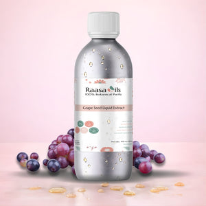 Bottle of Raasa Oils Grape Seed Liquid Extract with grapes on a pink background