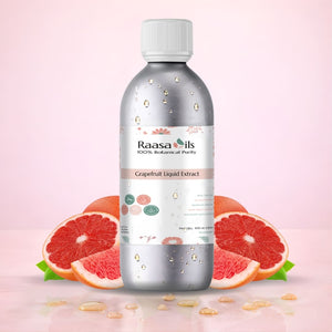 Bottle of Raasa Oils Grapefruit Liquid Extract with grapefruit slices on a pink background