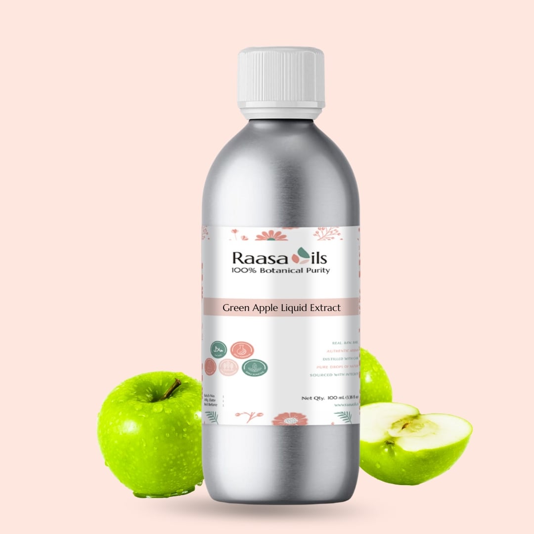 Bottle of Raasa Oils Green Apple Liquid Extract with green apples on a light pink background