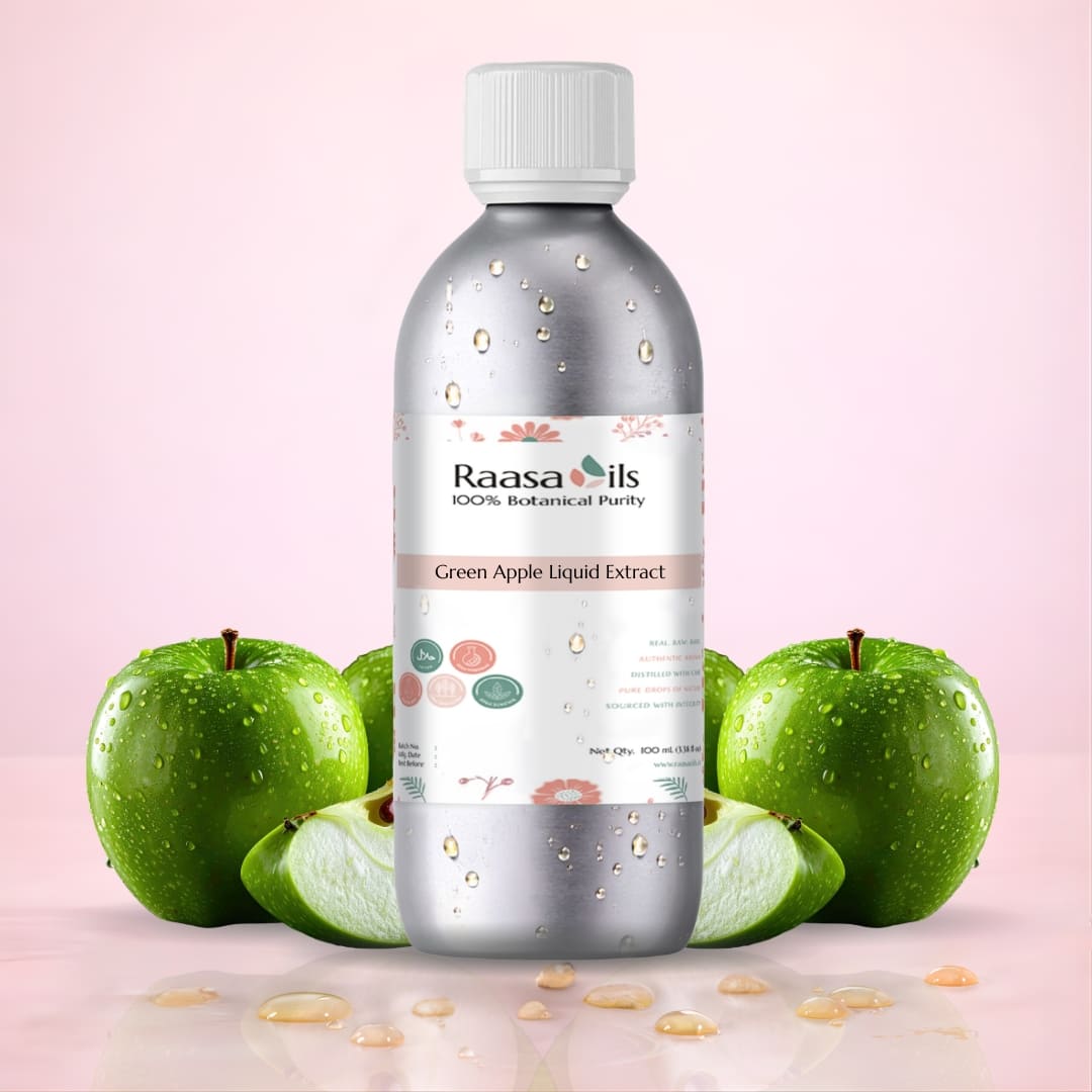 Bottle of Raasa Oils Green Apple Liquid Extract with green apples on a pink background