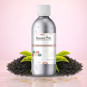 Bottle of Raasa Oils Green Tea Liquid Extract with tea leaves and tea leaves on a pink background