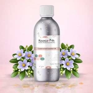 Raasa Oils Gulaalwood Essential Oil bottle with flowers on a pink background