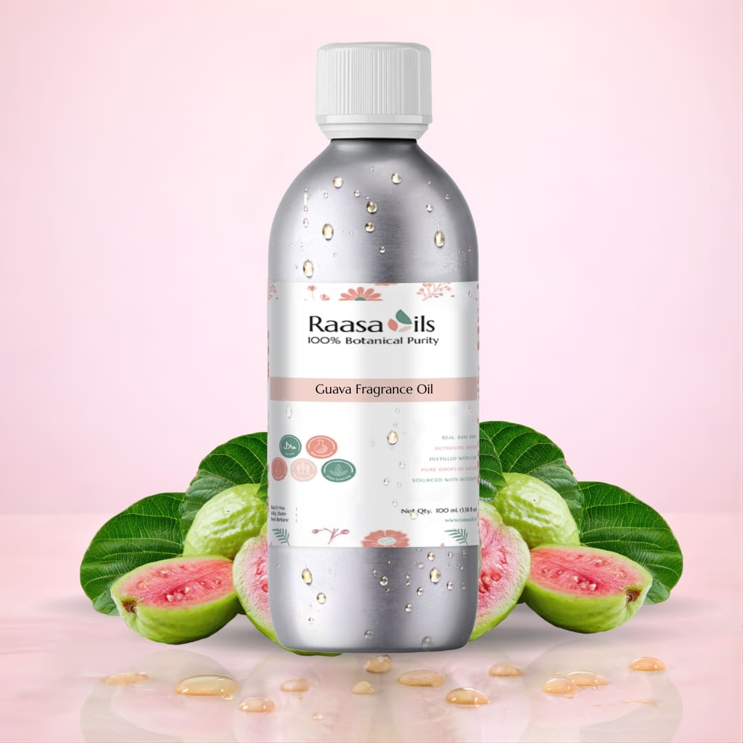 Bottle of Raasa Oils Guava Fragrance Oil with guava fruits and leaves on a pink background