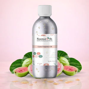 Bottle of Raasa Oils Guava Fragrance Oil with guava fruits and leaves on a pink background