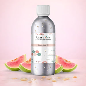 Bottle of Raasa Oils Guava Seed Oil with guava fruits on a pink background