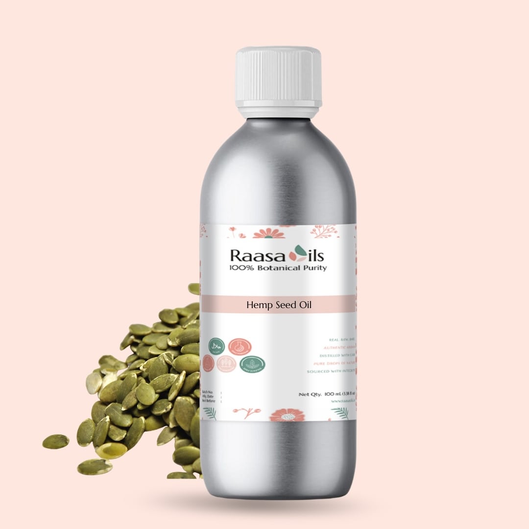 Bottle of Raasa Oils Hemp Seed Oil with seeds on a light pink background