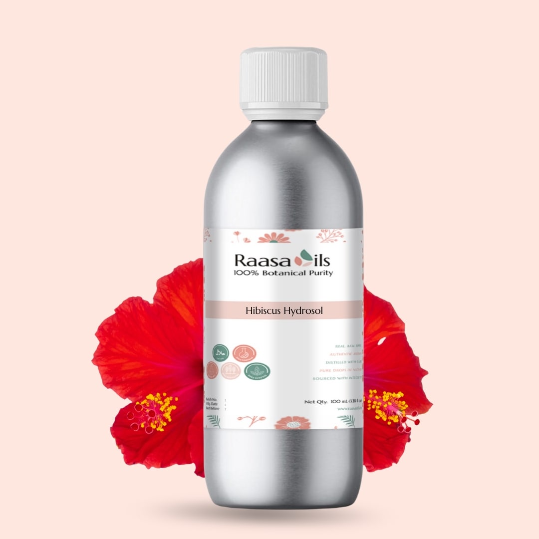 Bottle of Raasa Oils Hibiкус Hydrosol with a red flower on a beige background