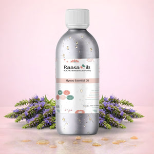 Raasa Oils Hysop Essential Oil bottle with lavender flowers on a pink background