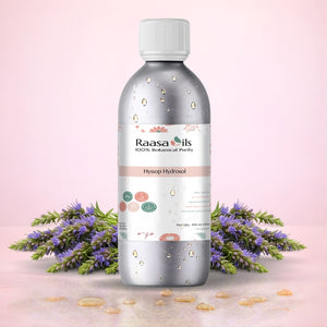 Raasa Oils bottle with lavender flowers on a pink background