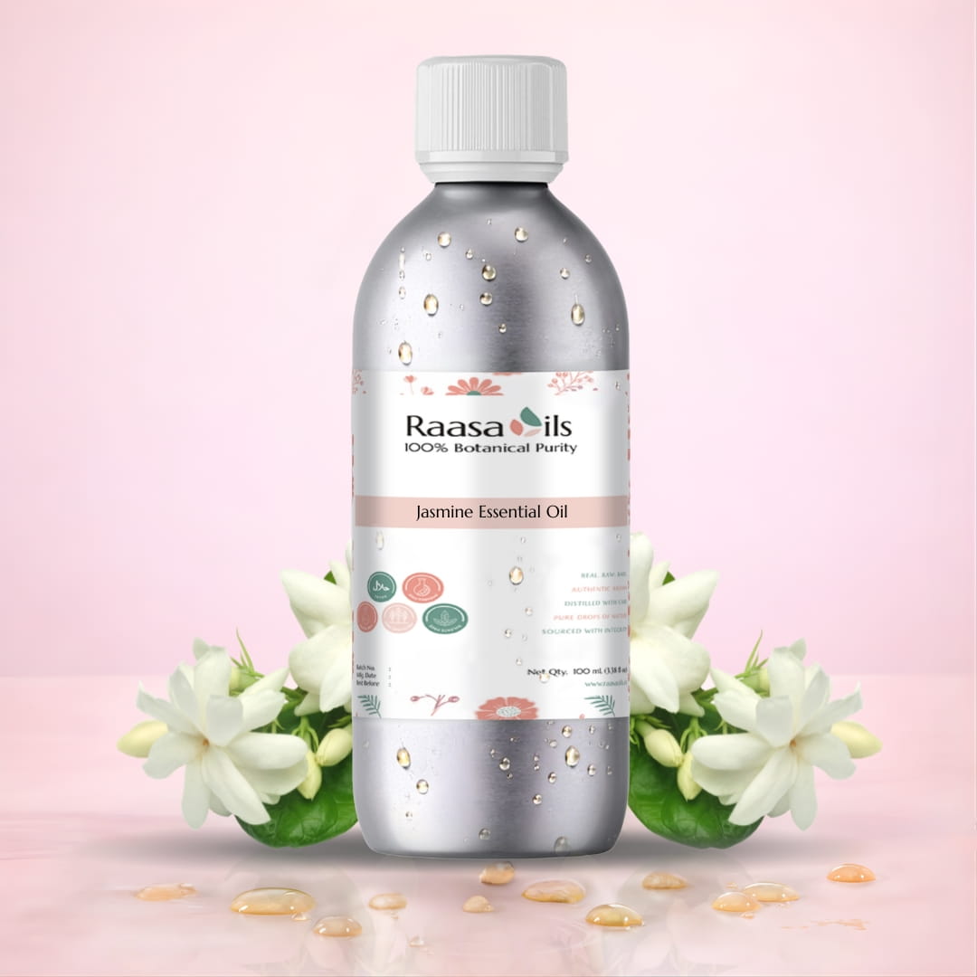 Bottle of Raasa Oils Jasmine Essential Oil with jasmine flowers on a pink background