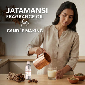 Woman pouring liquid into a glass with Jatamansi fragrance oil for candle making on a wooden table.