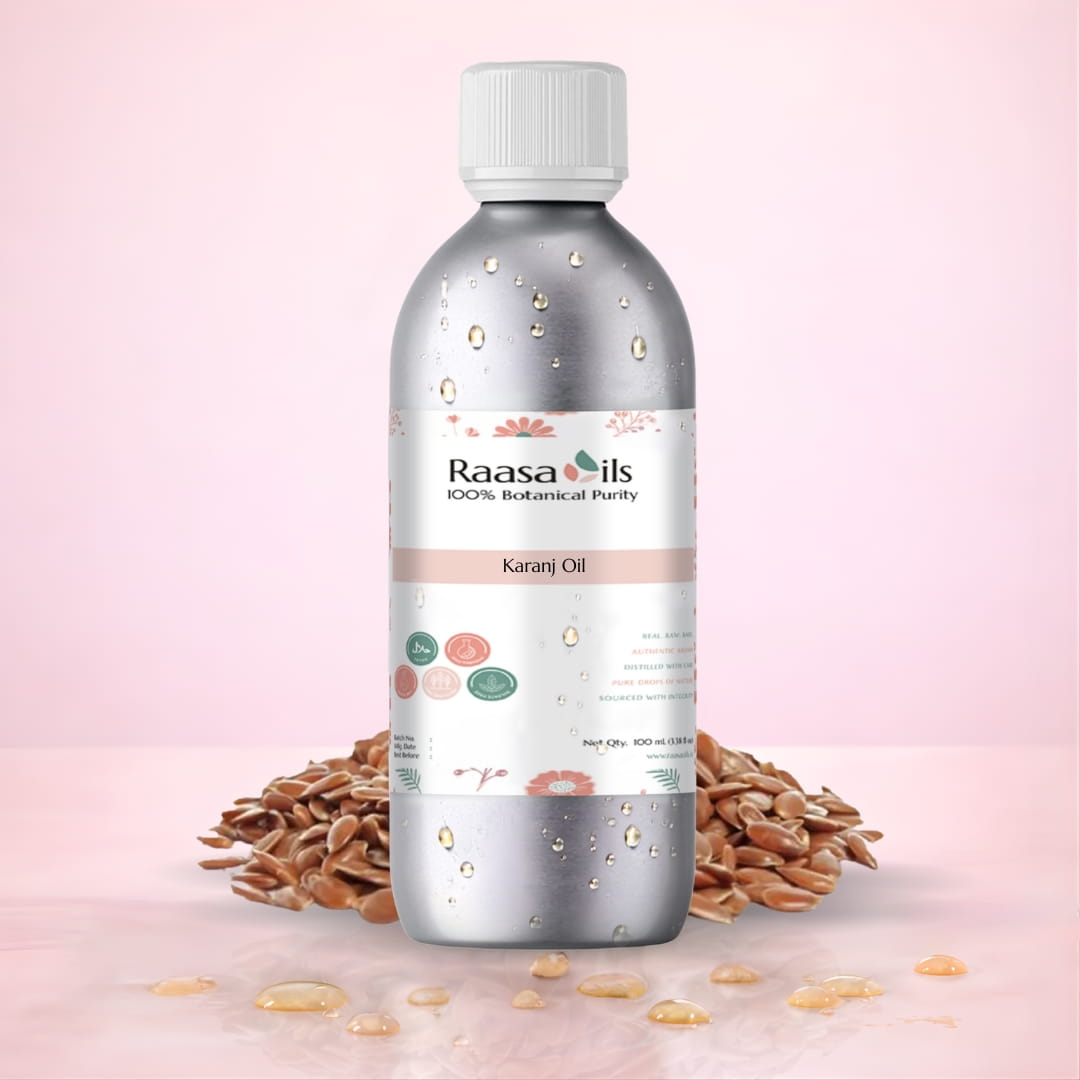 Bottle of Raasa Oils Karanj Oil with seeds on a pink background