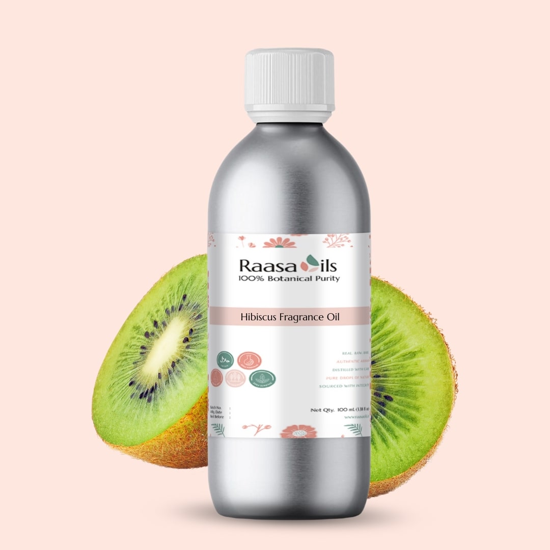 Bottle of Raasa Oils Hibiscus Fragrance Oil with a sliced kiwi fruit on a light pink background