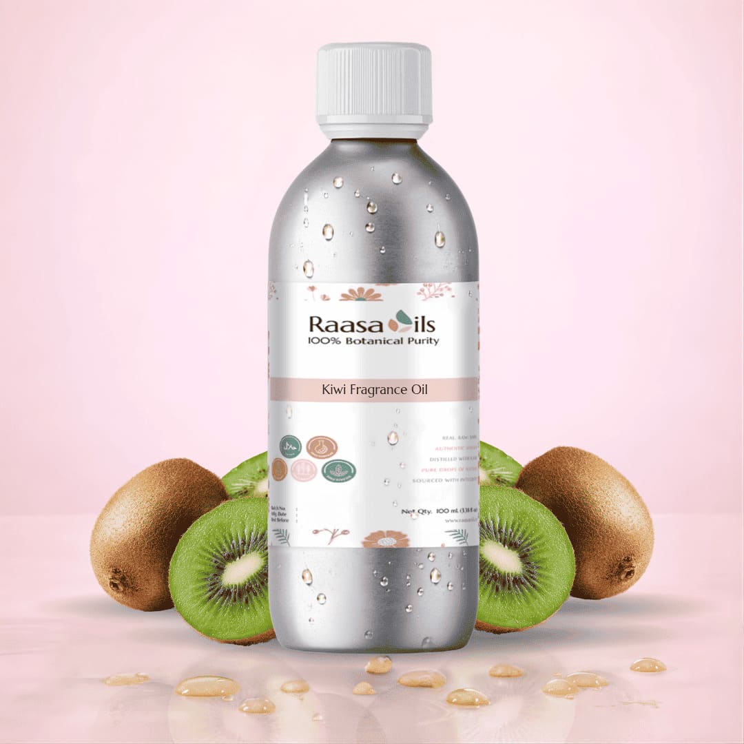 Bottle of Raasa Oils Kiwi Fragrance Oil with kiwi fruits on a pink background