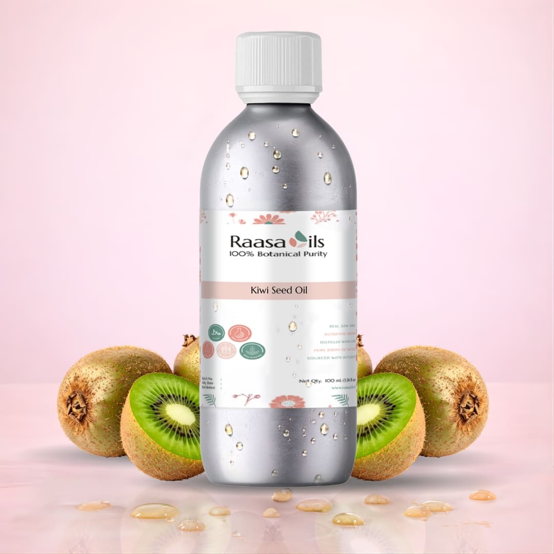Bottle of Raasa Oils Kiwi Seed Oil with kiwi fruits on a pink background