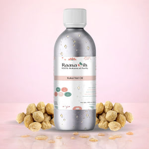 Bottle of Raasa Oils Kukui Nut Oil with nuts on a pink background