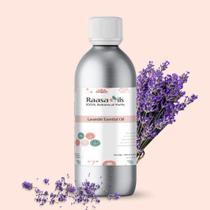 Raasa Oils Lavandin Essential Oil bottle with lavender flowers on a beige background