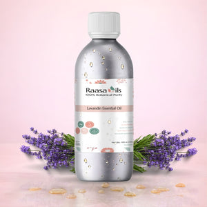 Raasa Oils Lavandin Essential Oil bottle with lavender flowers on a pink background